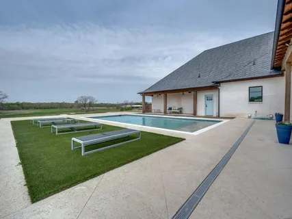 a view of an house with backyard and outdoor space