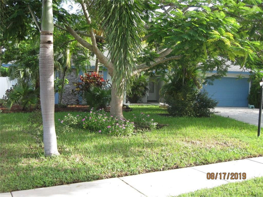 9629 Trivolo Place Boca Raton, FL 33434 - Photo 1 of 7 a garden view with a sitting space