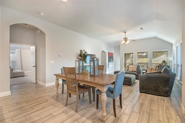 a view of a livingroom with furniture and wooden floor