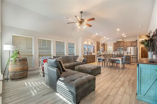 a living room with furniture and a table