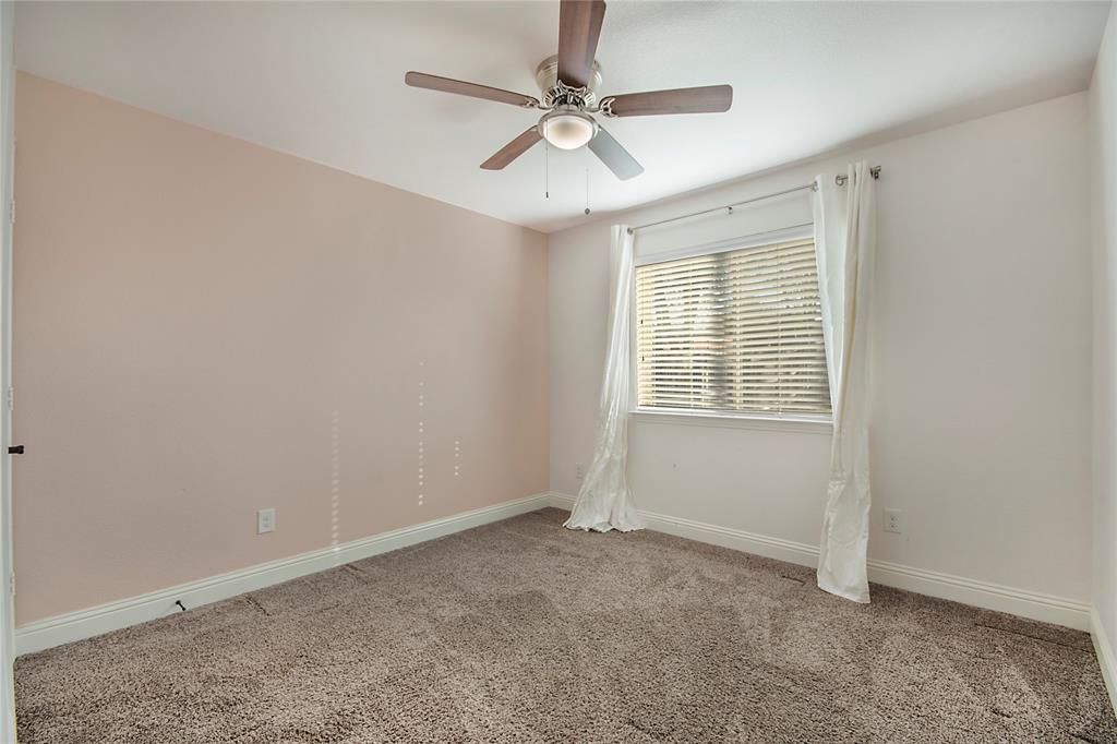 5116 Prospect Street McKinney, TX 75071 - Photo 16 of 23 an empty room with windows and fan