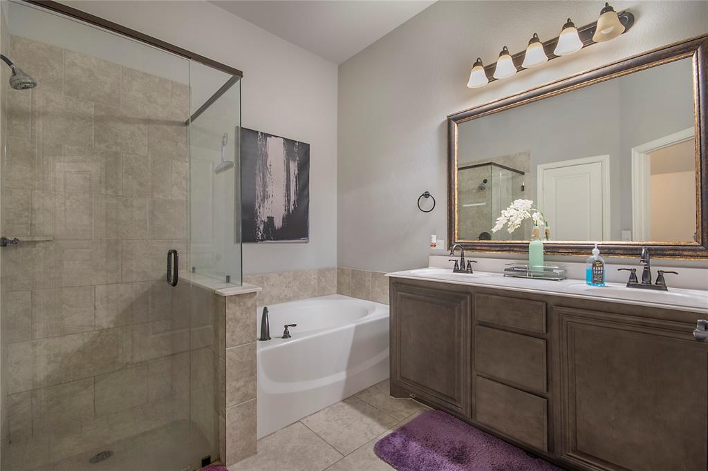5116 Prospect Street McKinney, TX 75071 - Photo 10 of 23 a bathroom with a double vanity sink mirror and bathtub
