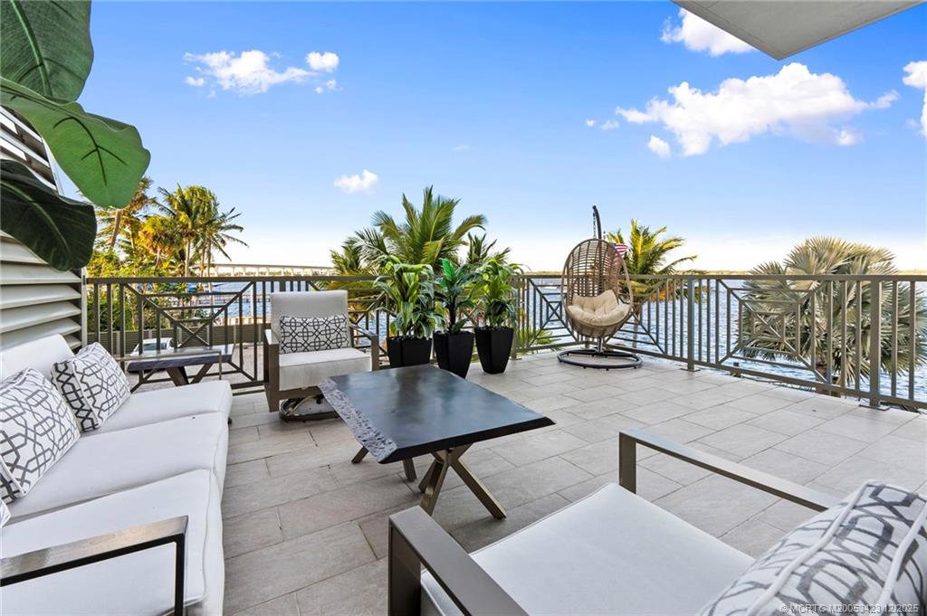 41 Southwest Seminole Street, Unit 206 Stuart, FL 34994 - Photo 22 of 79 a outdoor living space with furniture and a potted plant