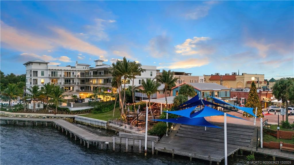 41 Southwest Seminole Street, Unit 206 Stuart, FL 34994 - Photo 65 of 79 a view of a city with tall buildings