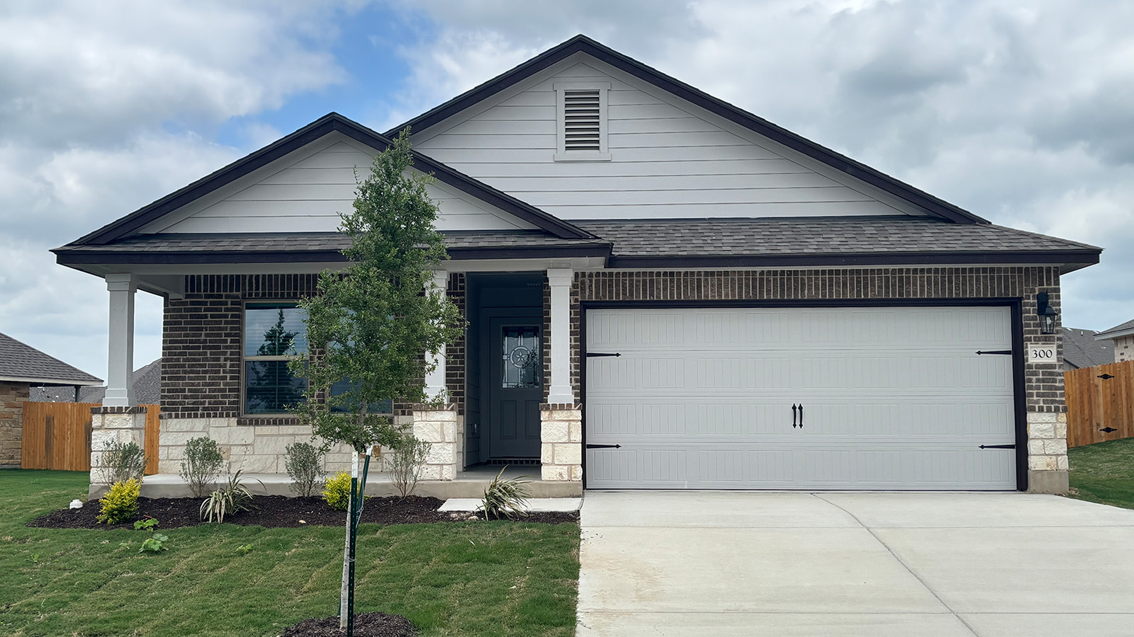 300 Creekfall Road Burnet, TX 78611 - Photo 1 of 23 a front view of house with a garden