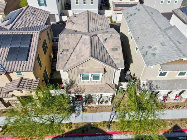 an aerial view of a house with a yard