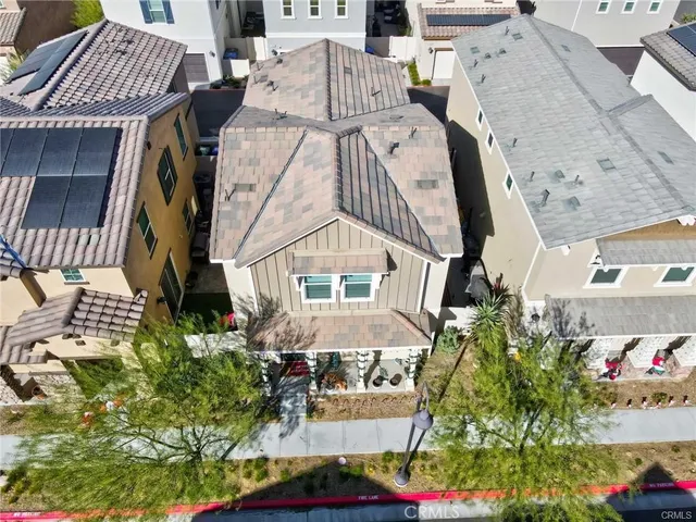 an aerial view of a house with a yard