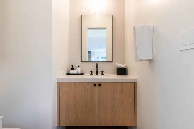 a view of bathroom with dual sinks