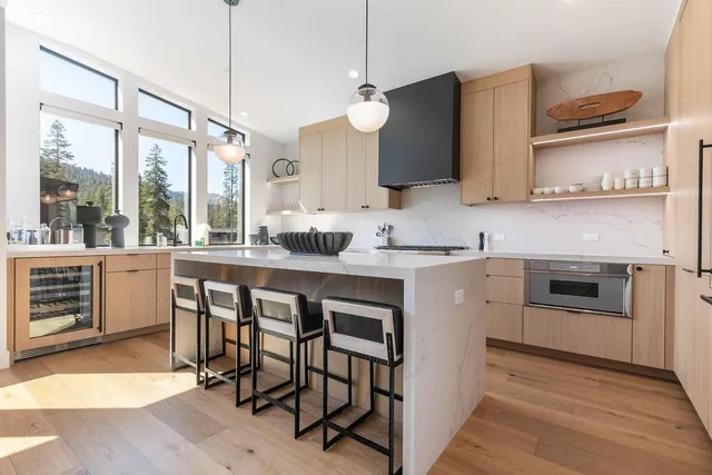 a kitchen with a stove a sink and a refrigerator