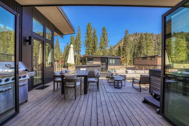 a dining room with furniture window and wooden floor