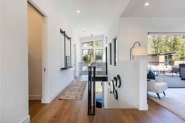 a view of living room with furniture and floor to ceiling window