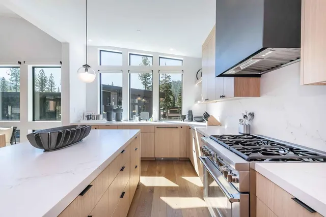 a kitchen that has a sink and a stove