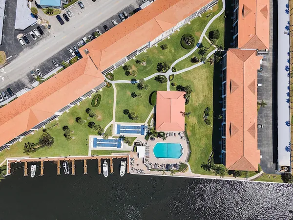 a kitchen with granite countertop a sink stove and cabinets