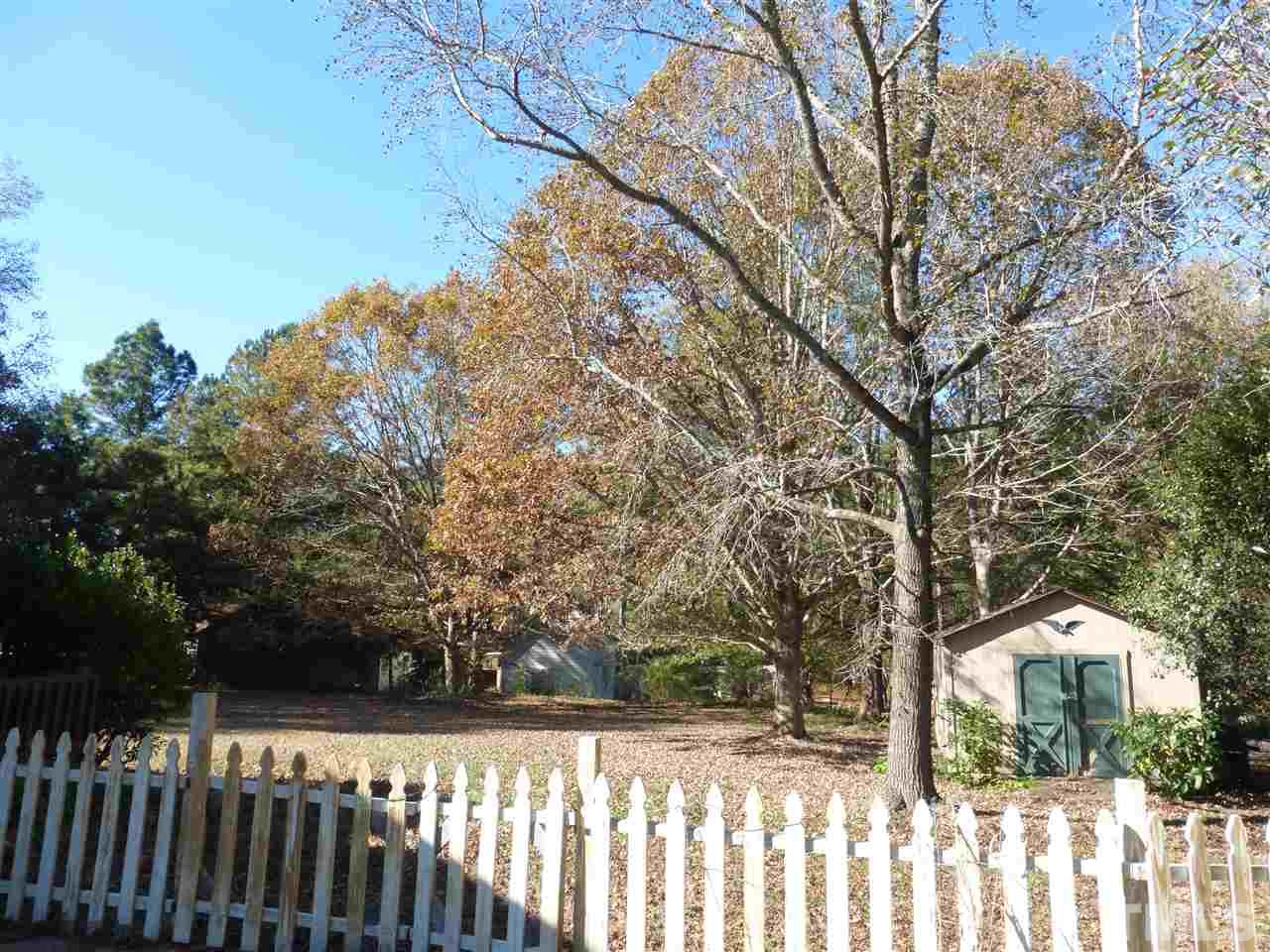 5224 Carrier Way Raleigh, NC 27603 - Photo 14 of 23 a view of a wooden fence and trees