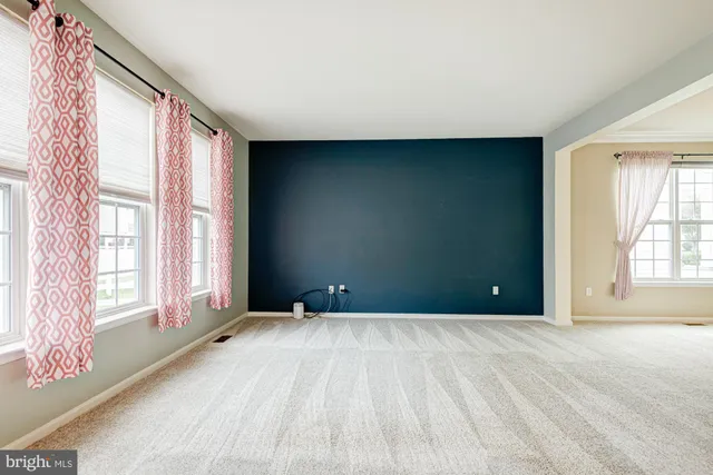 a kitchen with stainless steel appliances granite countertop a refrigerator stove and sink