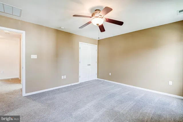 a bathroom with a tub a sink and a large mirror
