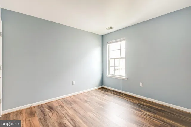 a view of a livingroom with a ceiling fan and window