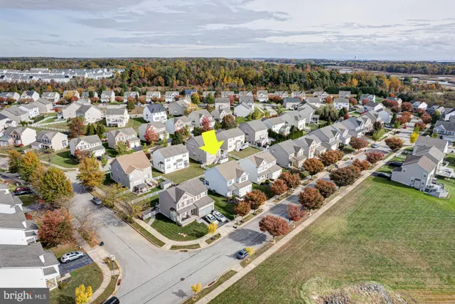 an aerial view of a house with a ocean view