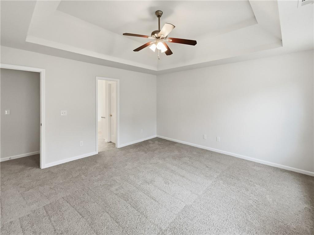 836 Tara Bend Hampton, GA 30228 - Photo 11 of 25 an empty room with ceiling fan and window