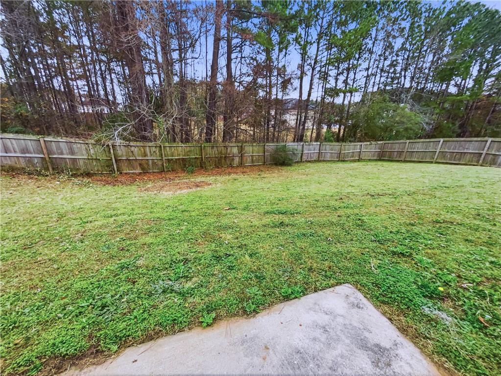 836 Tara Bend Hampton, GA 30228 - Photo 22 of 25 a view of a yard with a fence