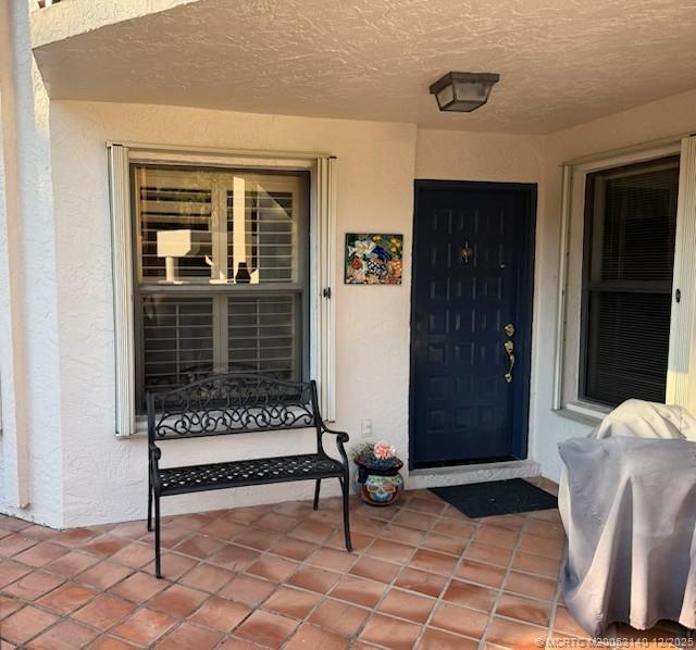 a view of outdoor space with porch and wooden floor