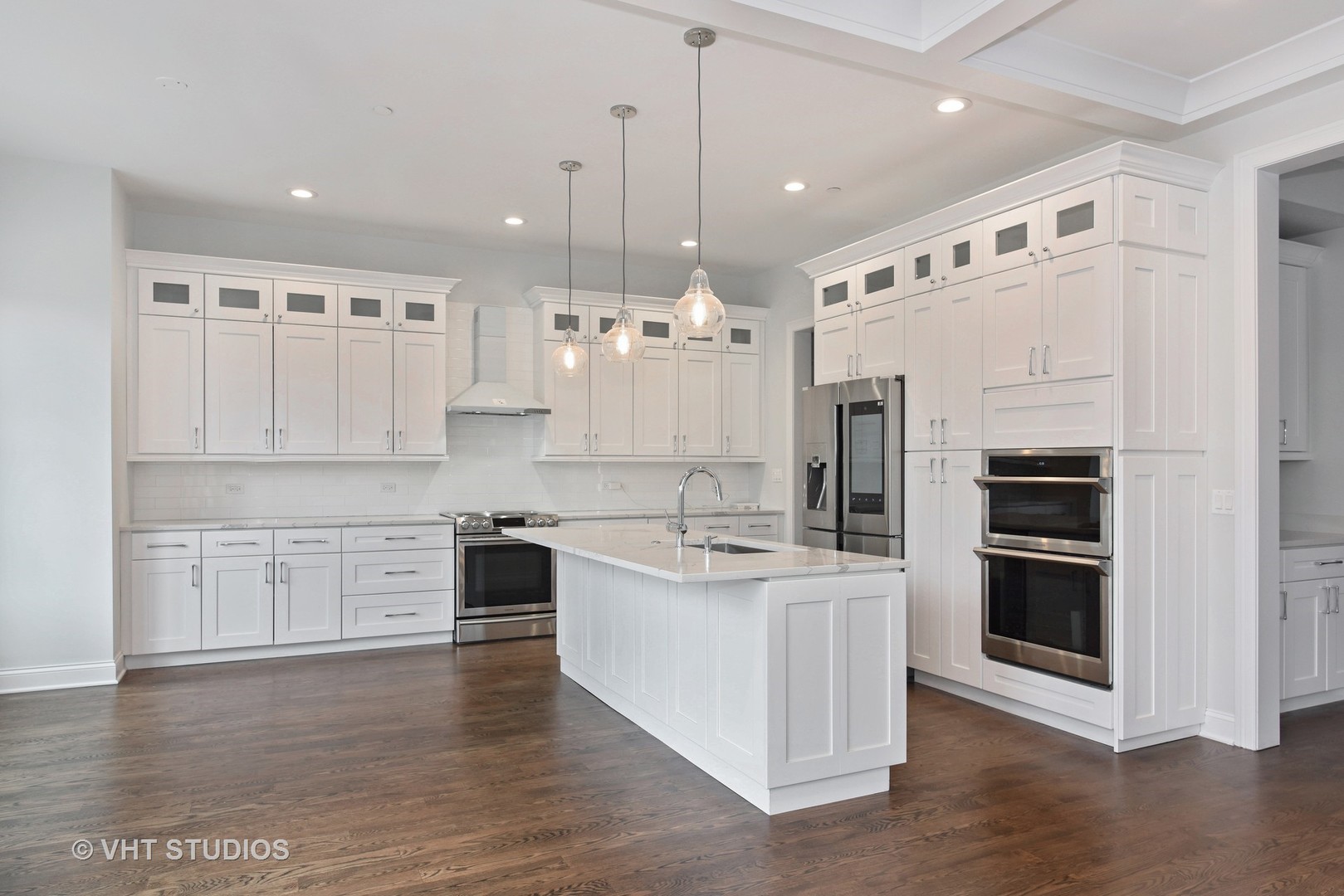 2424 Illinois Road Northbrook, IL 60062 - Photo 3 of 14 a large kitchen with stainless steel appliances granite countertop a stove and a refrigerator