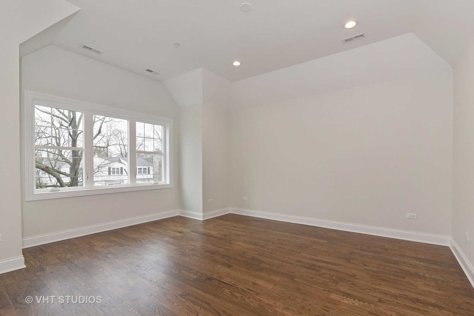2424 Illinois Road Northbrook, IL 60062 - Photo 8 of 14 an empty room with wooden floor and windows