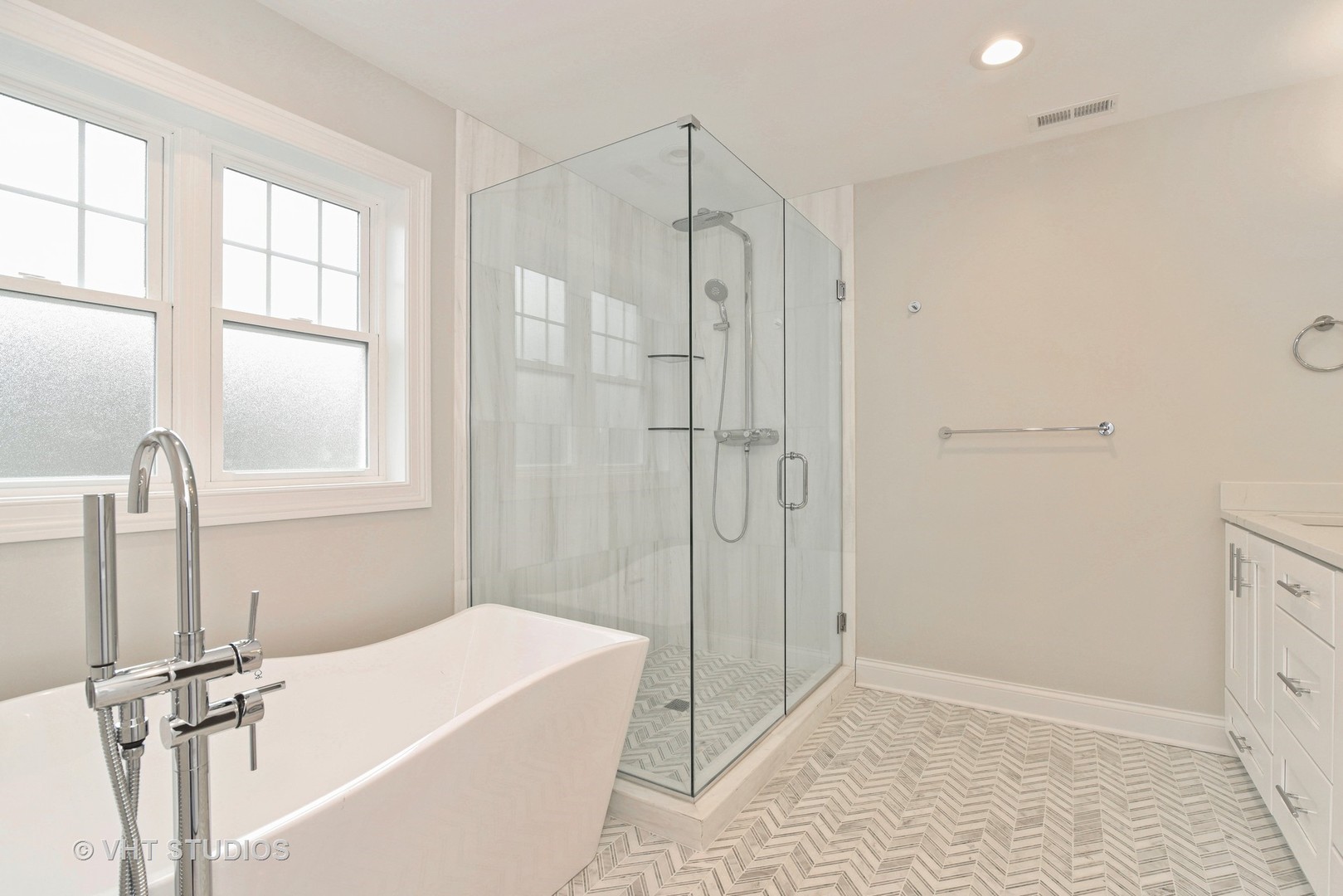 2424 Illinois Road Northbrook, IL 60062 - Photo 9 of 14 a bathroom with a tub shower and window
