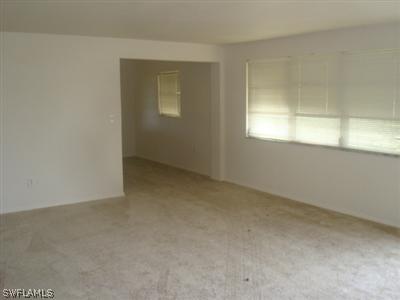 107 Oregon Road West Lehigh Acres, FL 33936 - Photo 7 of 10 an empty room with a window