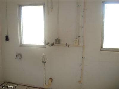 107 Oregon Road West Lehigh Acres, FL 33936 - Photo 10 of 10 a bathroom with a window