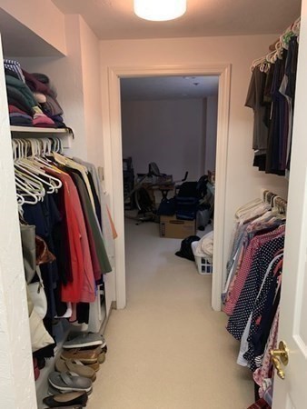 44 Elm Street, Unit 518 Worcester, MA 01609 - Photo 15 of 20 a view of walk in closet with clothes and shoes