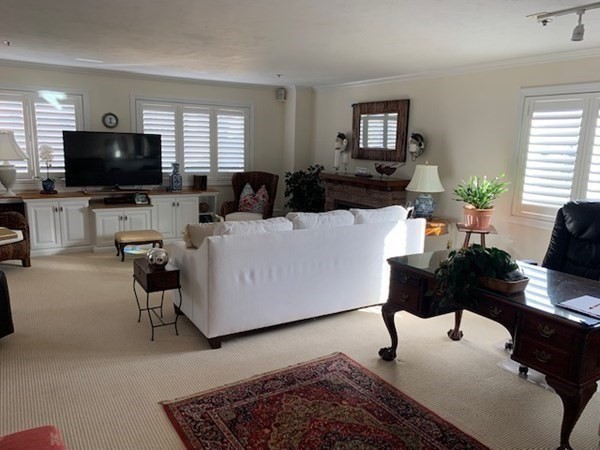 44 Elm Street, Unit 518 Worcester, MA 01609 - Photo 2 of 20 a living room with furniture and a flat screen tv