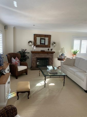 44 Elm Street, Unit 518 Worcester, MA 01609 - Photo 4 of 20 a living room with furniture and a fireplace