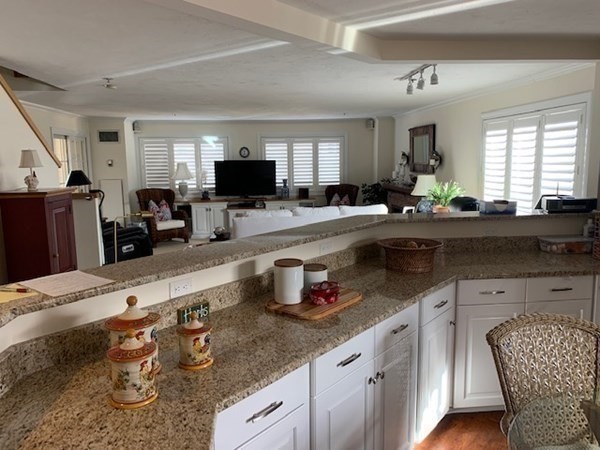 44 Elm Street, Unit 518 Worcester, MA 01609 - Photo 5 of 20 a kitchen with granite countertop a sink and a stove top oven