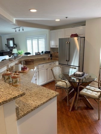 44 Elm Street, Unit 518 Worcester, MA 01609 - Photo 7 of 20 a kitchen with stainless steel appliances granite countertop a sink refrigerator and microwave