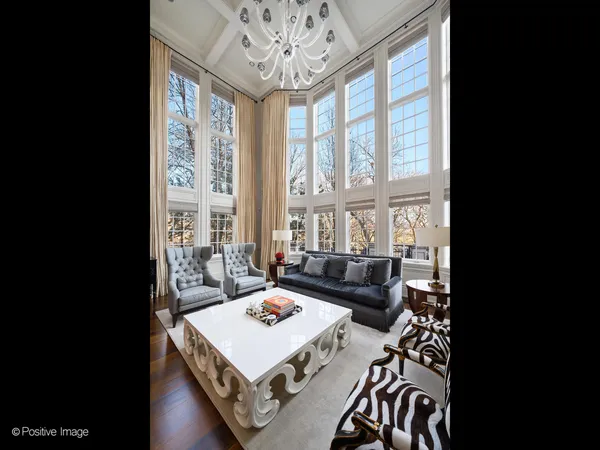 a view of an empty room with a fireplace and a window