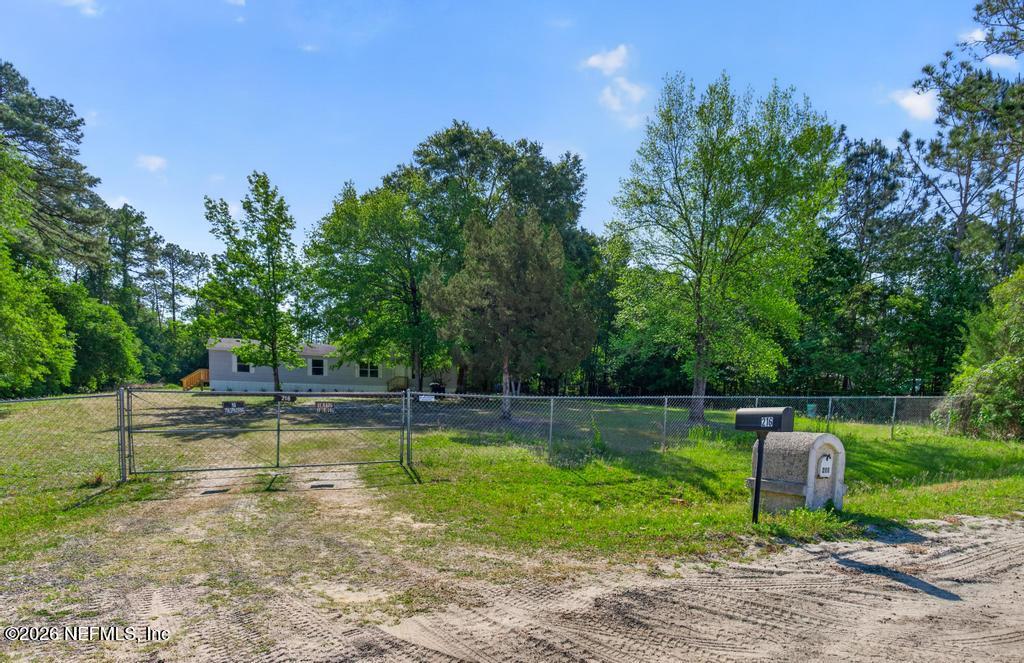 216 Yucca Street Middleburg, FL 32068 - Photo 1 of 60 a view of a swimming pool with a yard