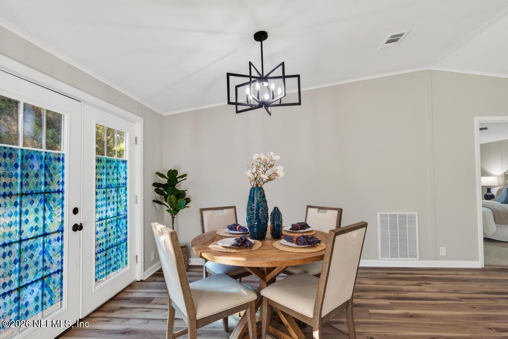 216 Yucca Street Middleburg, FL 32068 - Photo 15 of 60 a view of a dining room with furniture window and wooden floor