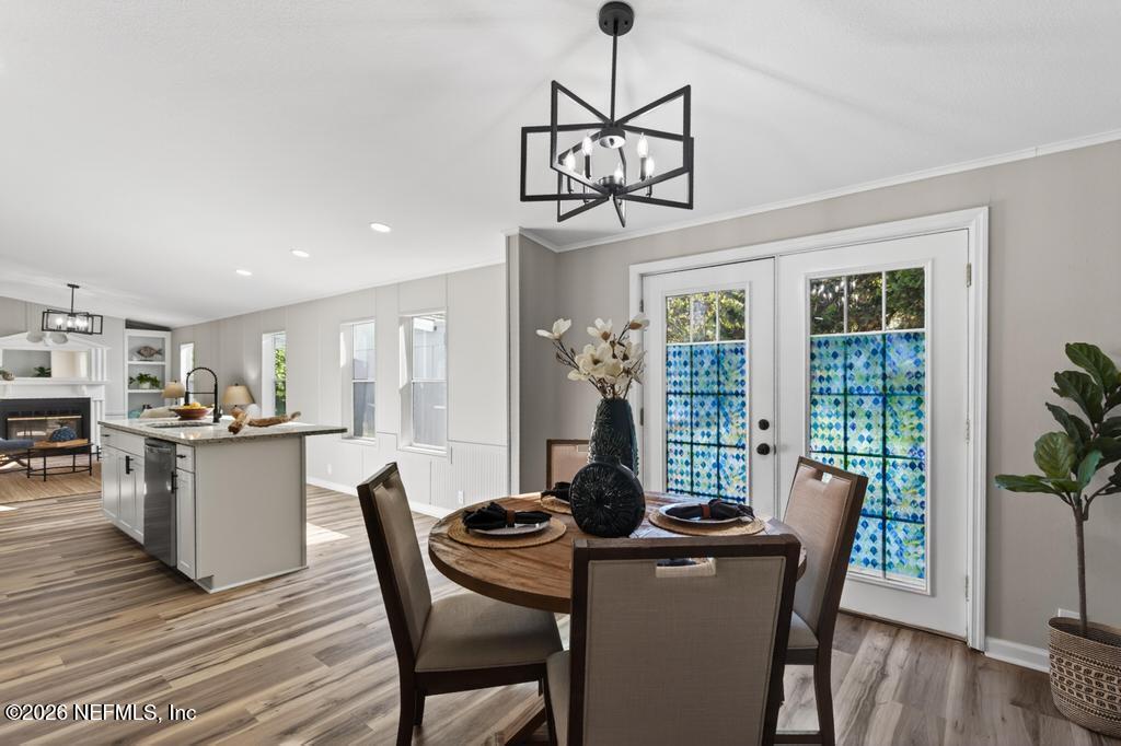 216 Yucca Street Middleburg, FL 32068 - Photo 25 of 60 a view of a dining room with furniture window and wooden floor