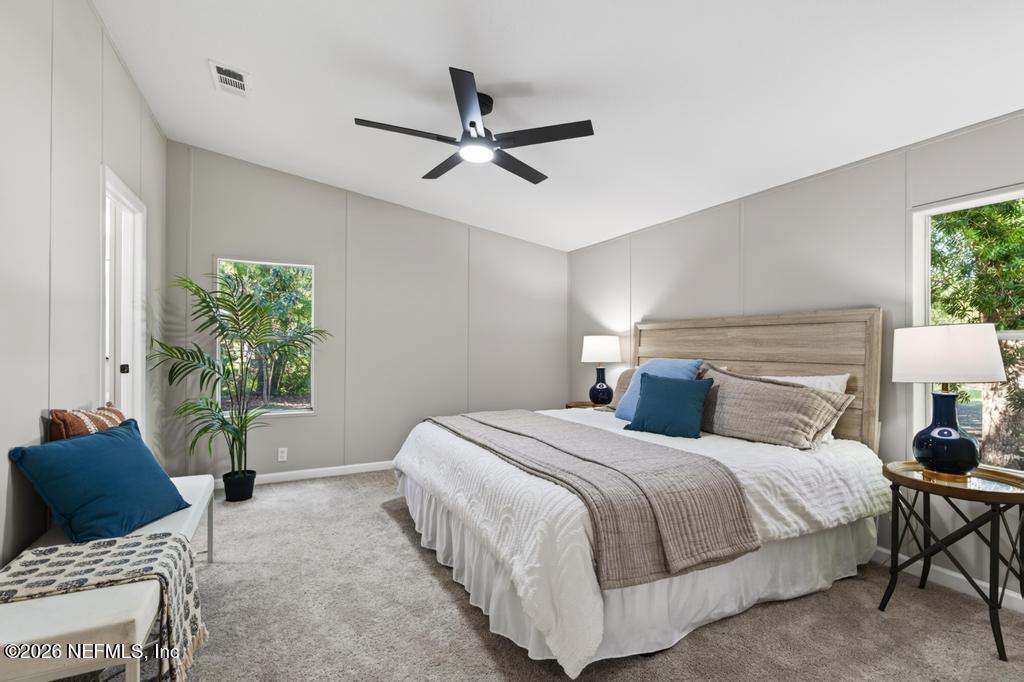 216 Yucca Street Middleburg, FL 32068 - Photo 29 of 60 a bedroom with a bed and window