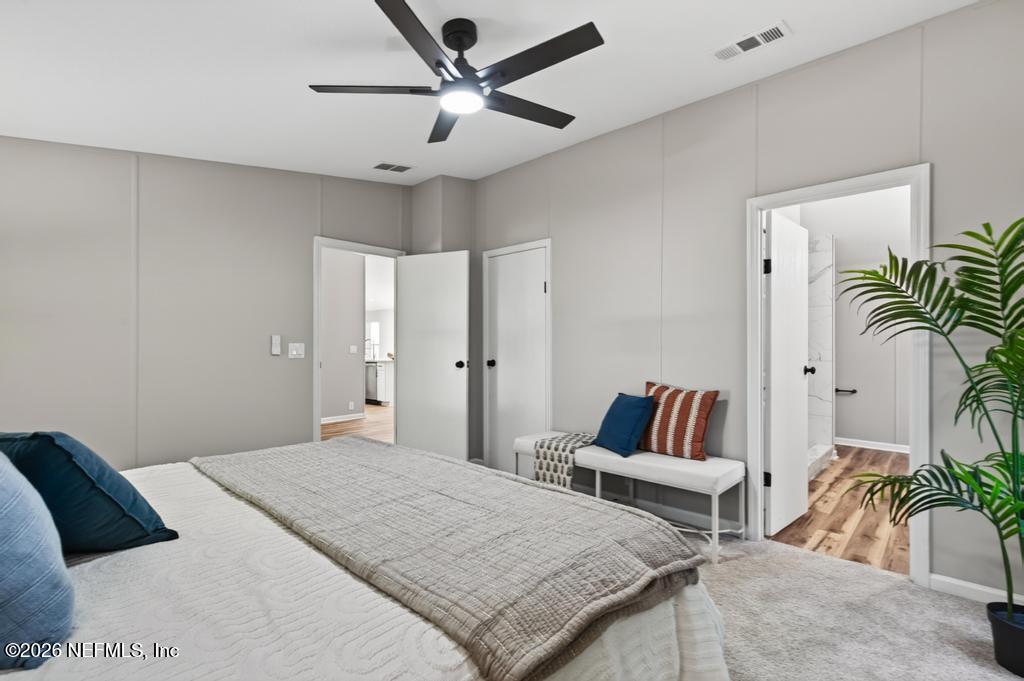 216 Yucca Street Middleburg, FL 32068 - Photo 31 of 60 a bedroom with a bed and a couch