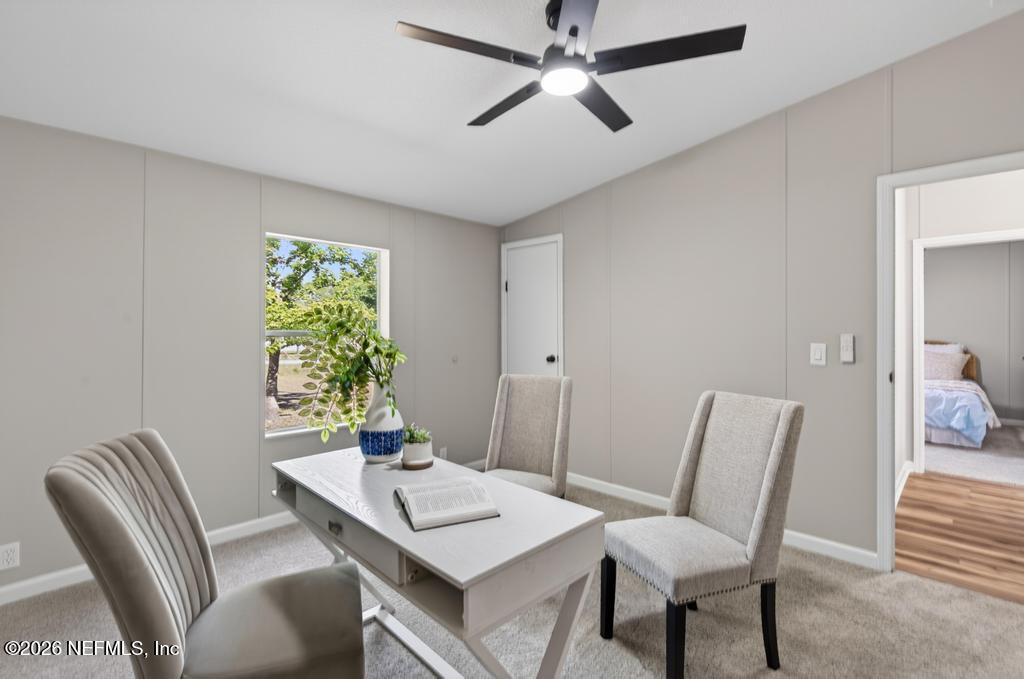 216 Yucca Street Middleburg, FL 32068 - Photo 40 of 60 a view of a dining room with furniture window and wooden floor