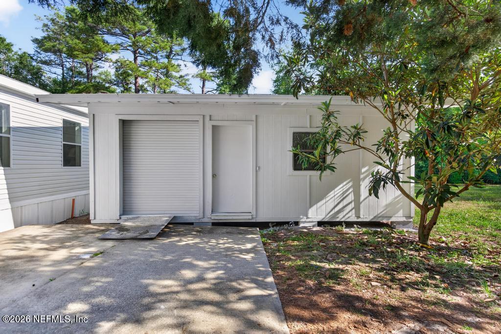 216 Yucca Street Middleburg, FL 32068 - Photo 51 of 60 a view of a house with a yard