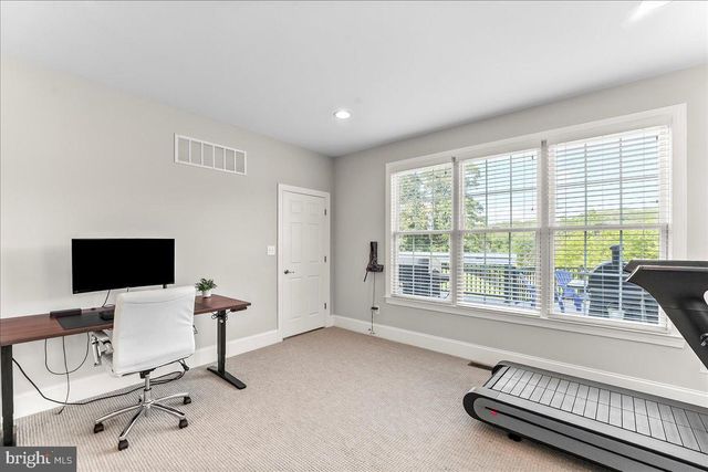 a bathroom with a granite countertop sink two mirror and a