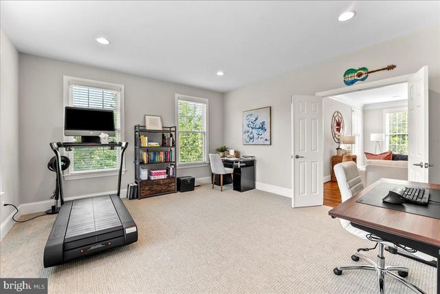 a spacious bedroom with a bed and a window