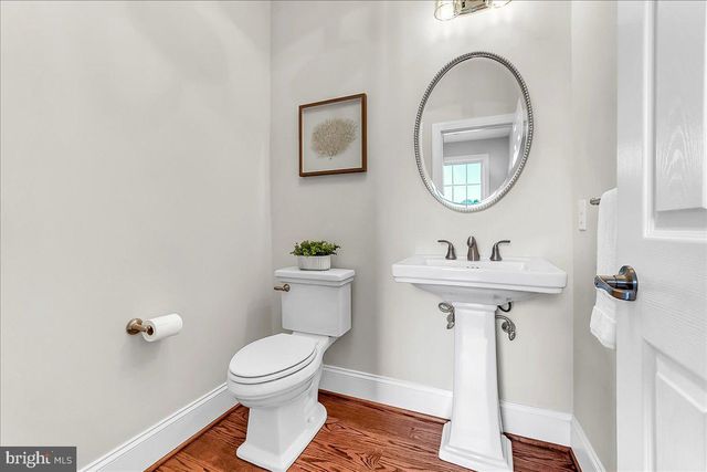a bathroom with a sink double vanity and a mirror