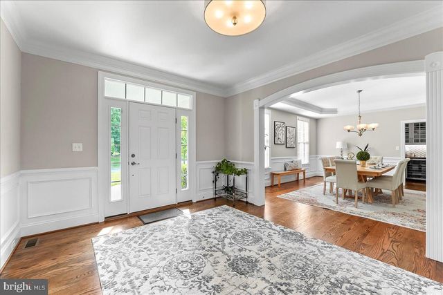 a view of entryway with wooden floor and a rug