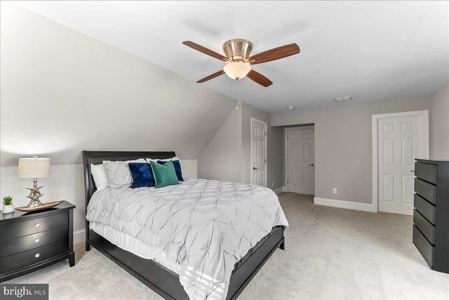 a aerial view of a house with swimming pool and a yard