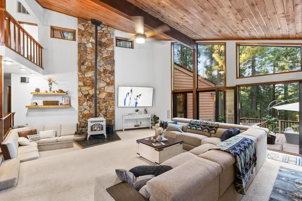 a kitchen with stainless steel appliances kitchen island granite countertop a stove a sink and a microwave