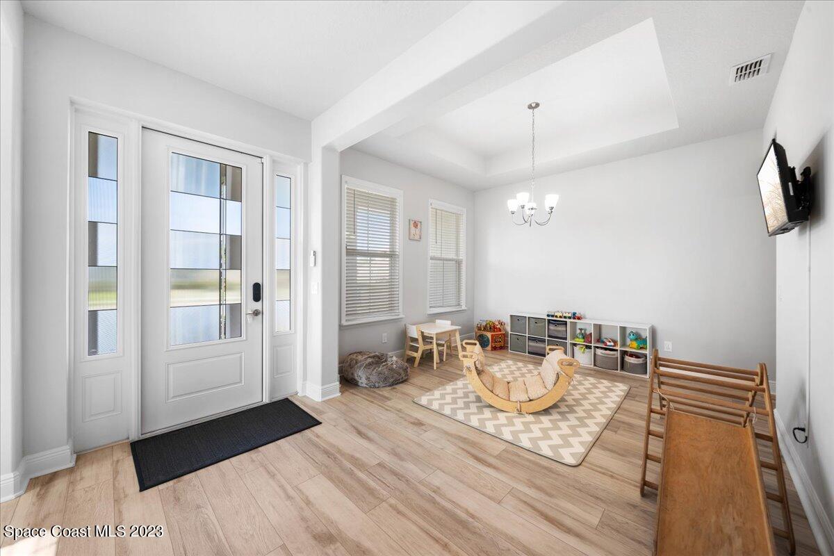 1582 Killian Drive Palm Bay, FL 32905 - Photo 11 of 37 a living room with furniture and a table